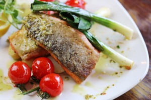 Roasted sea trout, baby leeks & roasted vine tomatoes, with crushed new potatoes, lime & spring onion salsa verde